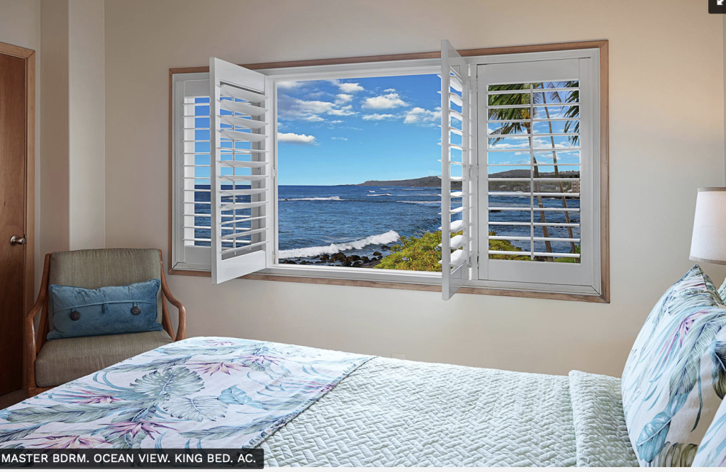 Master Bedroom with ocean view at the Poipu Stone House