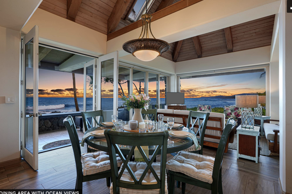 Ocean front dining room at the Poipu Stone House vacation rental